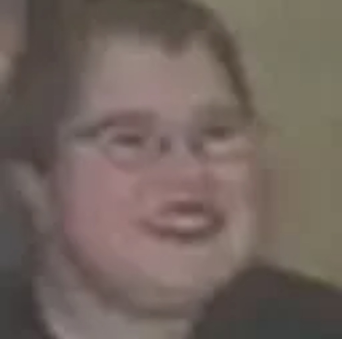 Glasses guy mascot grinning at the void
